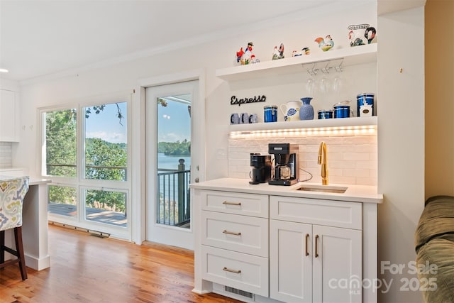 6664 Lake Shore Dr, Hickory, NC 28601 - indoor bar featuring light wood-type flooring and crown molding
