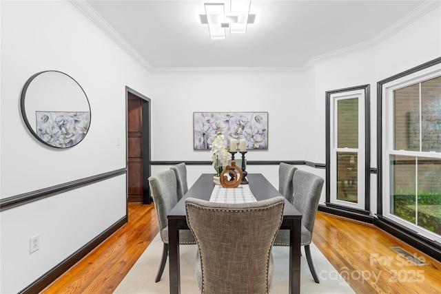4339 Shannamara Dr, Matthews, NC 28104 - dining space with crown molding and light wood-style flooring