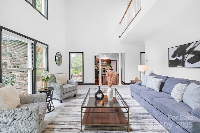 4339 Shannamara Dr, Matthews, NC 28104 - living room featuring light carpet and a towering ceiling
