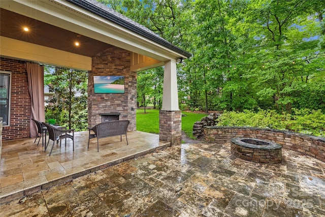 4339 Shannamara Dr, Matthews, NC 28104 - view of patio with an outdoor stone fireplace and a fire pit