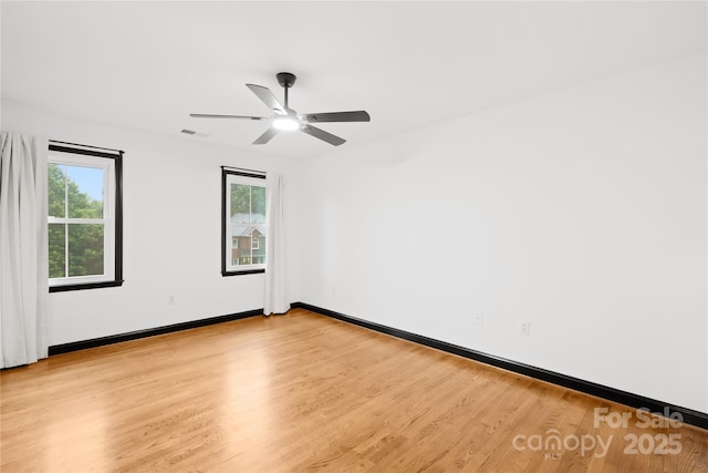 4339 Shannamara Dr, Matthews, NC 28104 - spare room with light wood-type flooring, ceiling fan, and baseboards