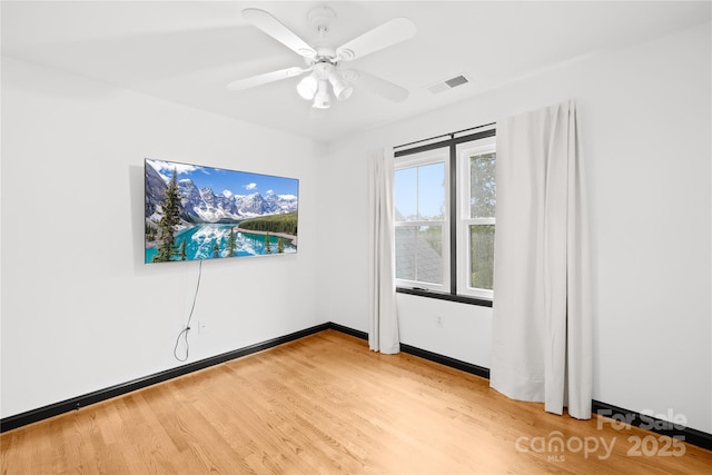 4339 Shannamara Dr, Matthews, NC 28104 - unfurnished room featuring light wood-type flooring, ceiling fan, and baseboards