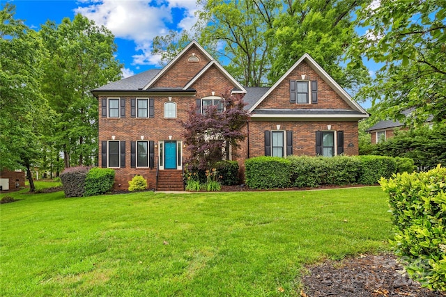 4339 Shannamara Dr, Matthews, NC 28104 - colonial home with a front lawn and brick siding