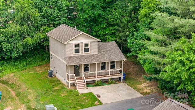 10 Coral Berry Dr, Candler, NC 28715 - view of front of home with a porch, central air condition unit, a front yard, and roof with shingles