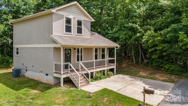 10 Coral Berry Dr, Candler, NC 28715 - view of front of house featuring crawl space, covered porch, a front lawn, central AC, and a shingled roof