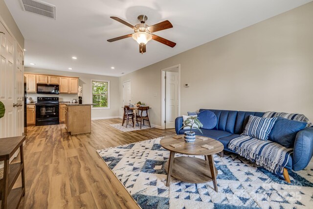 10 Coral Berry Dr, Candler, NC 28715 - living area with light wood finished floors, a ceiling fan, recessed lighting, and baseboards
