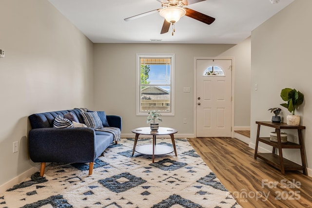 10 Coral Berry Dr, Candler, NC 28715 - living area featuring a ceiling fan, light wood-style flooring, and baseboards