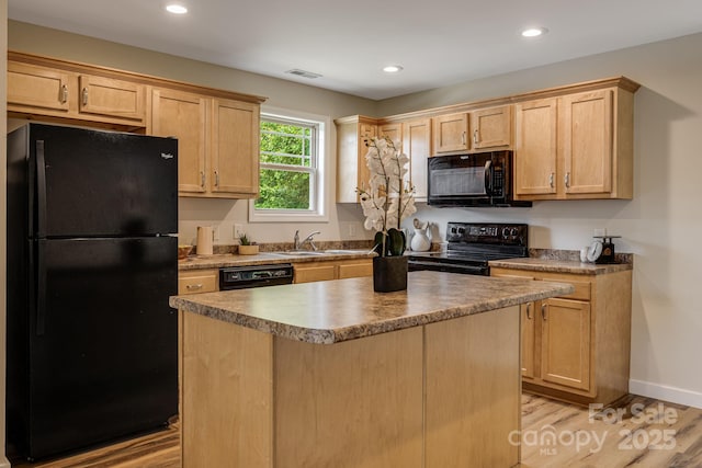 10 Coral Berry Dr, Candler, NC 28715 - kitchen featuring black appliances, a sink, light wood-style flooring, light brown cabinetry, and recessed lighting