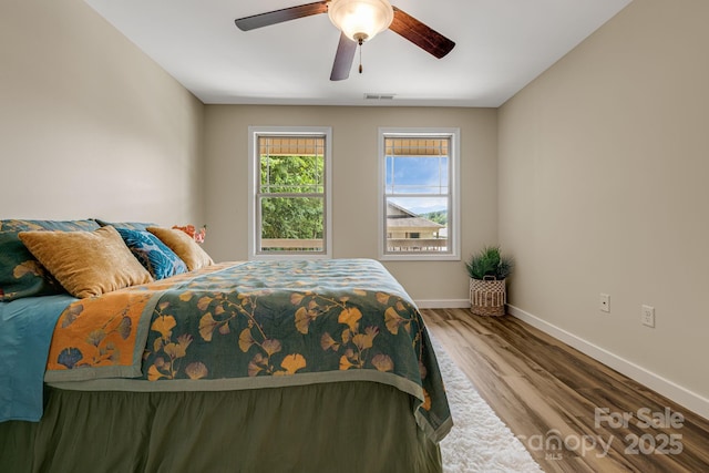 10 Coral Berry Dr, Candler, NC 28715 - bedroom with baseboards, wood finished floors, and ceiling fan