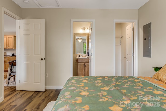 10 Coral Berry Dr, Candler, NC 28715 - bedroom featuring electric panel, wood finished floors, baseboards, a closet, and ensuite bathroom