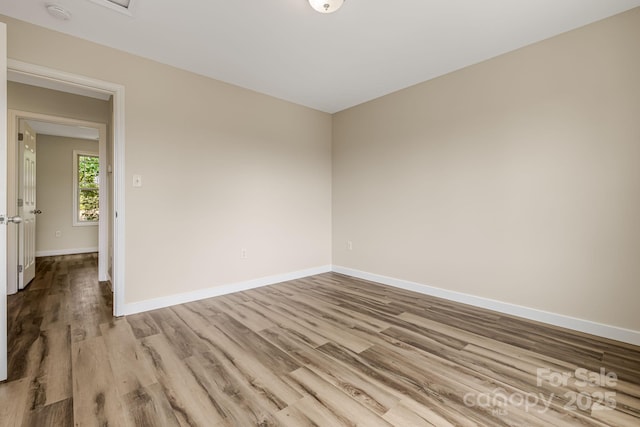 10 Coral Berry Dr, Candler, NC 28715 - empty room featuring wood finished floors, baseboards, and a smoke detector