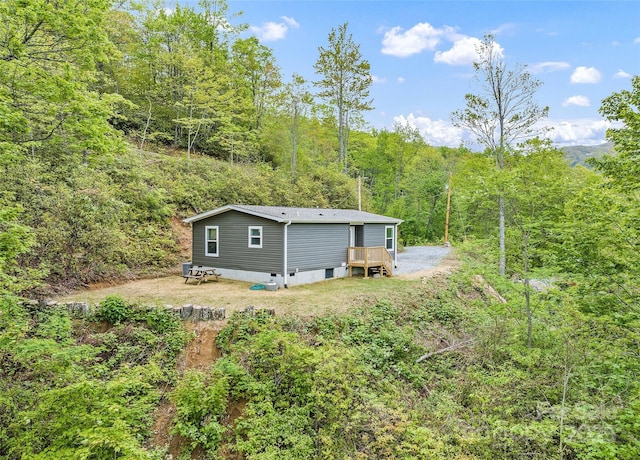 328 Mountain Lion Trl, Maggie Valley, NC 28751 - view of yard with a wooded view and a deck