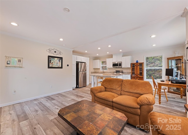 328 Mountain Lion Trl, Maggie Valley, NC 28751 - living room featuring ornamental molding, light wood-type flooring, recessed lighting, baseboards, and a desk