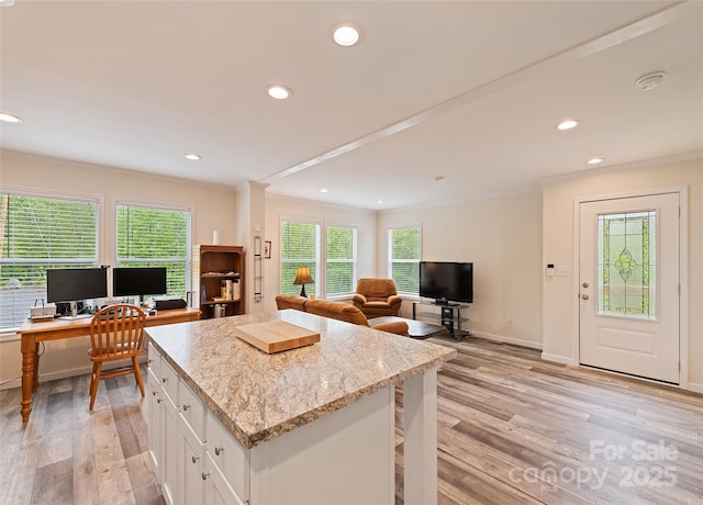 328 Mountain Lion Trl, Maggie Valley, NC 28751 - kitchen with ornamental molding, a desk, light wood-type flooring, open floor plan, and white cabinets