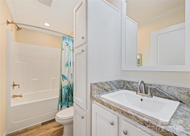 328 Mountain Lion Trl, Maggie Valley, NC 28751 - full bathroom with shower / bath combo, toilet, vanity, wood finished floors, and ornamental molding
