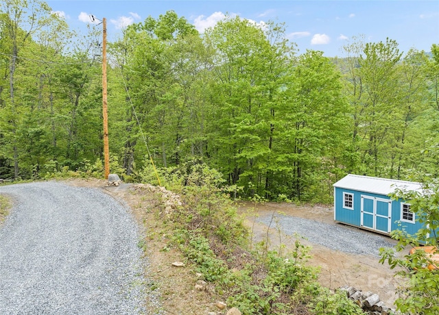 328 Mountain Lion Trl, Maggie Valley, NC 28751 - view of dirt / gravel road featuring a wooded view