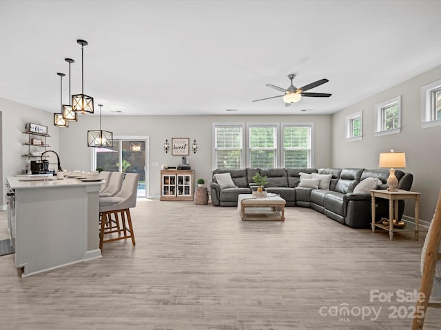 5013 Hamilton Mill Dr, Waxhaw, NC 28173 - living room featuring ceiling fan and light wood finished floors