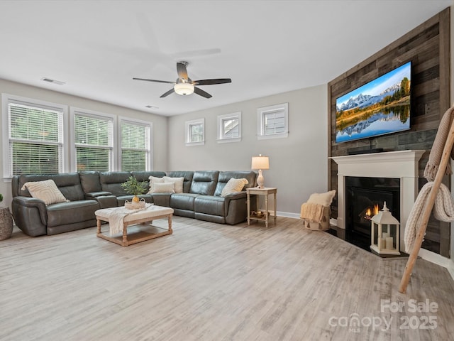5013 Hamilton Mill Dr, Waxhaw, NC 28173 - living area with ceiling fan, wood finished floors, and a fireplace