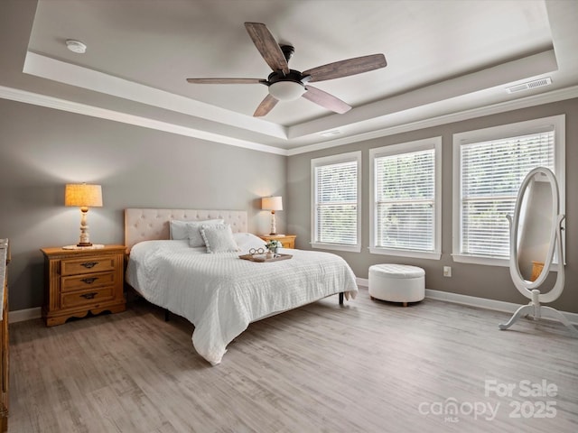 5013 Hamilton Mill Dr, Waxhaw, NC 28173 - bedroom featuring a raised ceiling, wood finished floors, ceiling fan, and crown molding