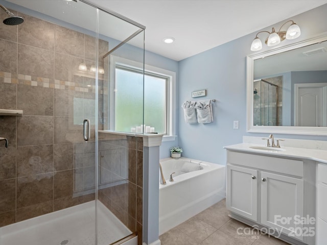 5013 Hamilton Mill Dr, Waxhaw, NC 28173 - bathroom with vanity, a shower stall, a garden tub, and tile patterned flooring