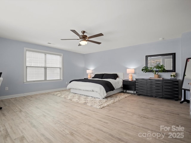 5013 Hamilton Mill Dr, Waxhaw, NC 28173 - bedroom with light wood finished floors and ceiling fan