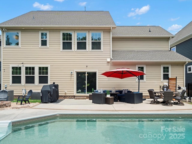 5013 Hamilton Mill Dr, Waxhaw, NC 28173 - rear view of house with an outdoor living space with a fire pit, a patio, and an outdoor pool
