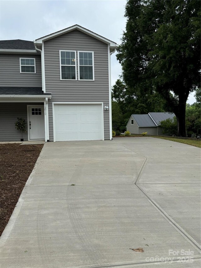 2012 Crown Point Dr Unit A, Albemarle, NC 28001 - view of front of house with concrete driveway and an attached garage