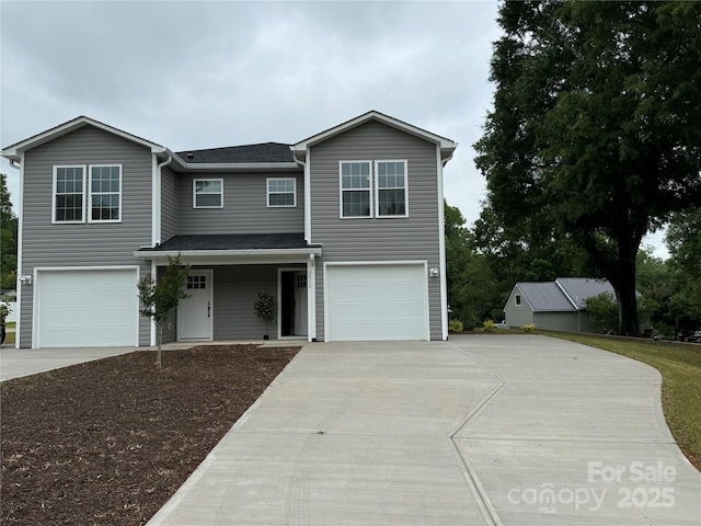 2012 Crown Point Dr Unit A, Albemarle, NC 28001 - view of front facade with driveway, a garage, and a shingled roof