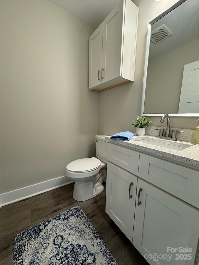 2012 Crown Point Dr Unit A, Albemarle, NC 28001 - half bath featuring wood finished floors, toilet, vanity, and baseboards