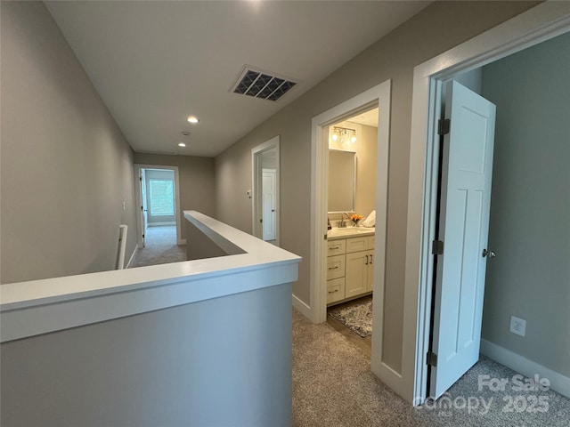 2012 Crown Point Dr Unit A, Albemarle, NC 28001 - hall with light colored carpet, a sink, recessed lighting, and baseboards