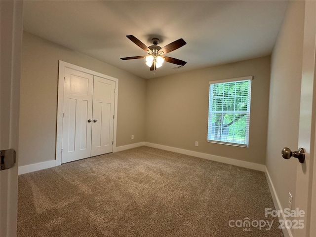 2012 Crown Point Dr Unit A, Albemarle, NC 28001 - unfurnished bedroom featuring carpet floors, baseboards, a closet, and ceiling fan