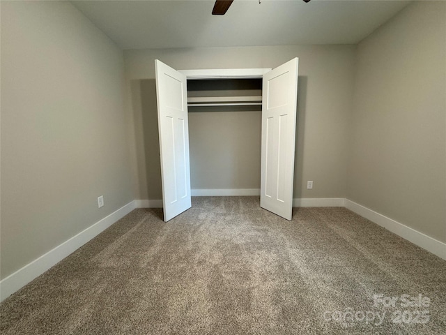 2012 Crown Point Dr Unit A, Albemarle, NC 28001 - unfurnished bedroom with carpet flooring, a closet, baseboards, and a ceiling fan