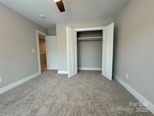2012 Crown Point Dr Unit A, Albemarle, NC 28001 - unfurnished bedroom with carpet flooring, a closet, baseboards, and ceiling fan