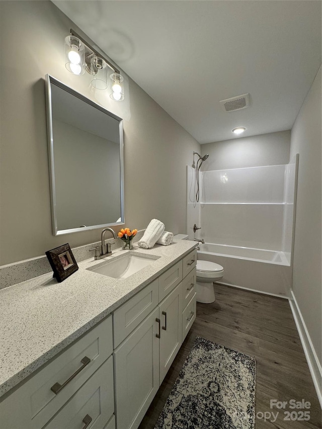 2012 Crown Point Dr Unit A, Albemarle, NC 28001 - bathroom featuring toilet,  shower combination, vanity, and wood finished floors