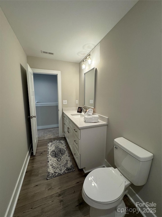 2012 Crown Point Dr Unit A, Albemarle, NC 28001 - bathroom with wood finished floors, vanity, toilet, and baseboards