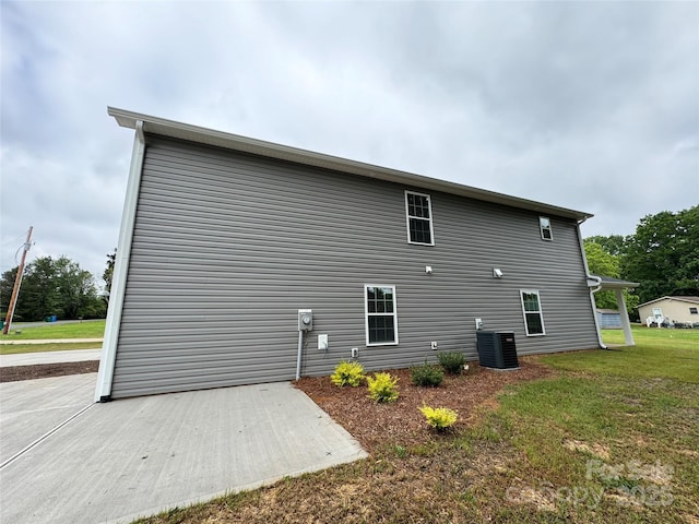 2012 Crown Point Dr Unit A, Albemarle, NC 28001 - view of property exterior featuring a lawn and central air condition unit