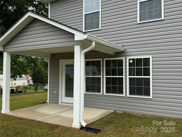 2012 Crown Point Dr Unit A, Albemarle, NC 28001 - property entrance featuring a patio and a lawn