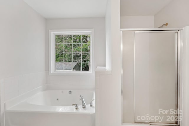 full bath with a shower stall and a tub with jets