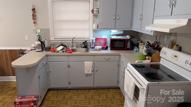 718 Dogwood Ave, Lincolnton, NC 28092 - kitchen featuring white electric range, under cabinet range hood, light countertops, a peninsula, and a sink