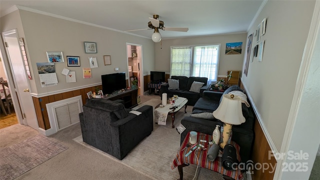 718 Dogwood Ave, Lincolnton, NC 28092 - living room with a ceiling fan, ornamental molding, a wainscoted wall, and wood walls