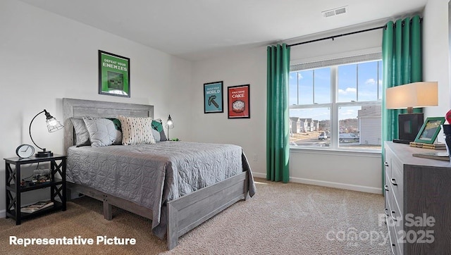 bedroom featuring light carpet and baseboards