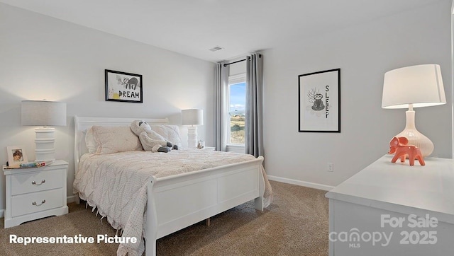 carpeted bedroom featuring baseboards