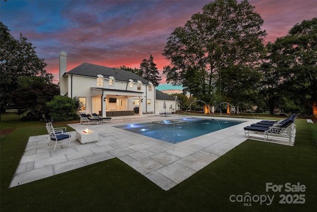 5806 Bentway Dr, Charlotte, NC 28226 - pool at dusk featuring a patio and an outdoor living space with a fire pit