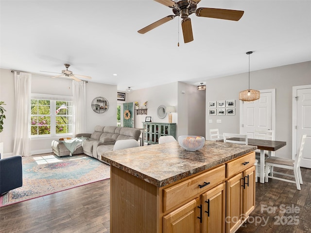 4 Greene Ln, Fletcher, NC 28732 - kitchen with ceiling fan, dark wood-style floors, dark countertops, open floor plan, and a kitchen island