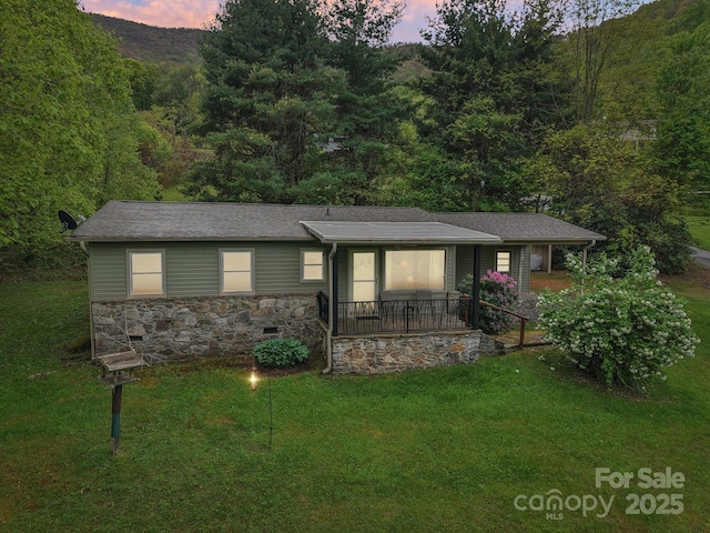 51 Atari Rd, Waynesville, NC 28786 - ranch-style house with a lawn, stone siding, a porch, and a view of trees