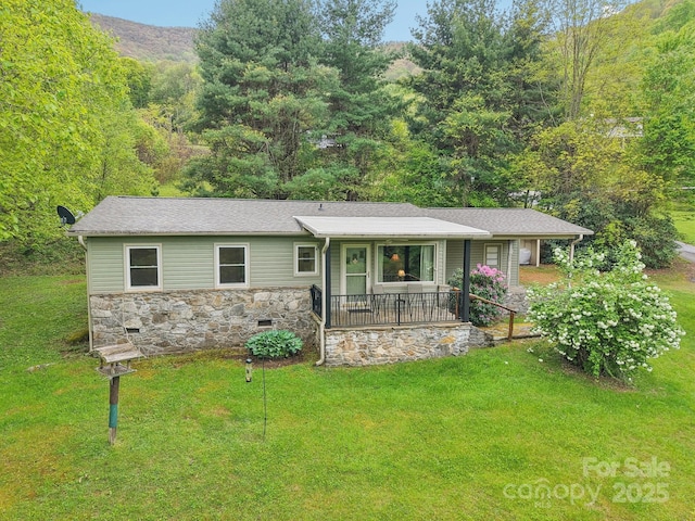 51 Atari Rd, Waynesville, NC 28786 - single story home with stone siding, a porch, a front yard, and a view of trees