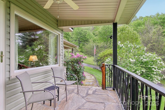 51 Atari Rd, Waynesville, NC 28786 - view of patio featuring a ceiling fan and a wooded view