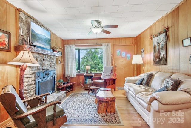 51 Atari Rd, Waynesville, NC 28786 - living room with wood walls, ceiling fan, and wood finished floors