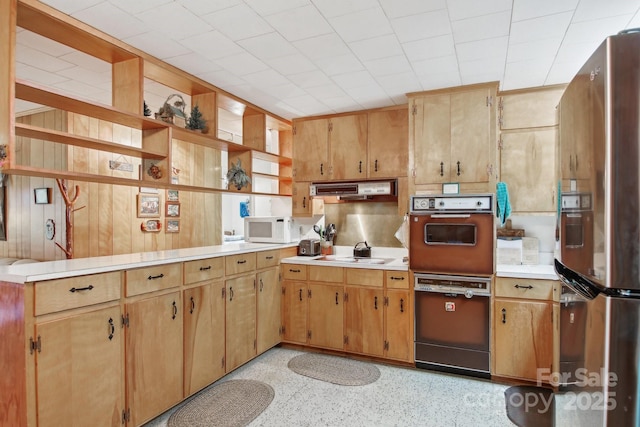 51 Atari Rd, Waynesville, NC 28786 - kitchen featuring white appliances, light countertops, under cabinet range hood, dark aggregate flooring, and open shelves