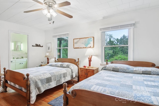 51 Atari Rd, Waynesville, NC 28786 - bedroom with wood finished floors, ensuite bath, and a ceiling fan